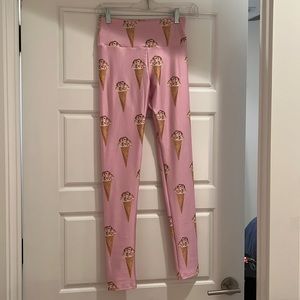 Goldsheep ice cream leggings with pink background. Worn once.